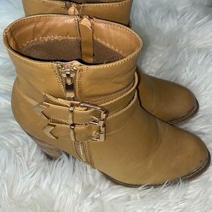 Tan ankle boots with gold hardware